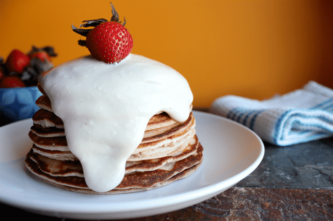 The BEST protein pancake recipe. These healthy strawberry cheesecake protein pancakes are truly a dream come true. #proteinpancakes #healthypancakes