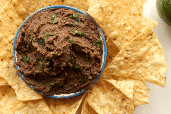 This black bean dip is deliciously healthy and simple. Plus, every serving has 10g of protein, and is less than 150 calories! #Healthy #Recipe