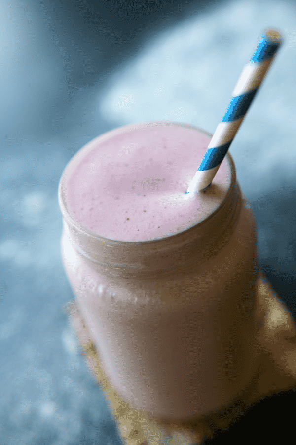 This Healthy Strawberry Milkshake Protein Shake is not only ridiculously delicious, but easy too. It only has 4 ingredients, 230 calories, and can easily be made vegan and dairy-free!