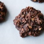 A chocolate and peanut butter oatmeal cookie on parchment paper