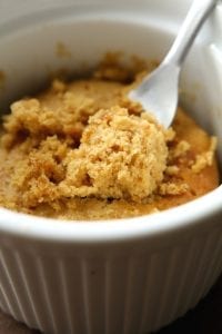 A low carb keto peanut butter mug cake in a mug.