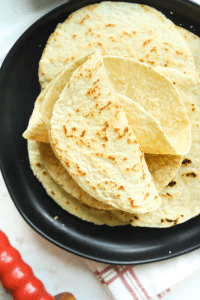 Keto Tortillas folded on a plate.