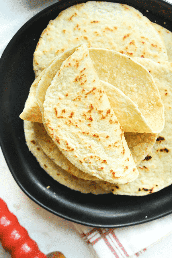 Keto tortillas folded on a plate