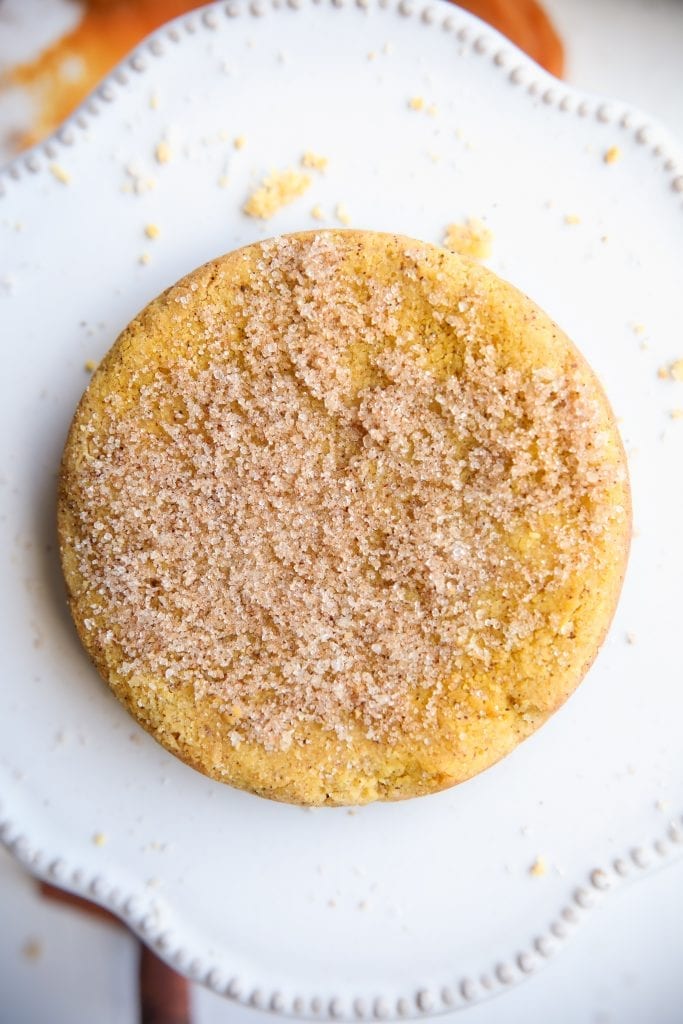 An up close photo of a pumpkin spice cookie on a serving plate