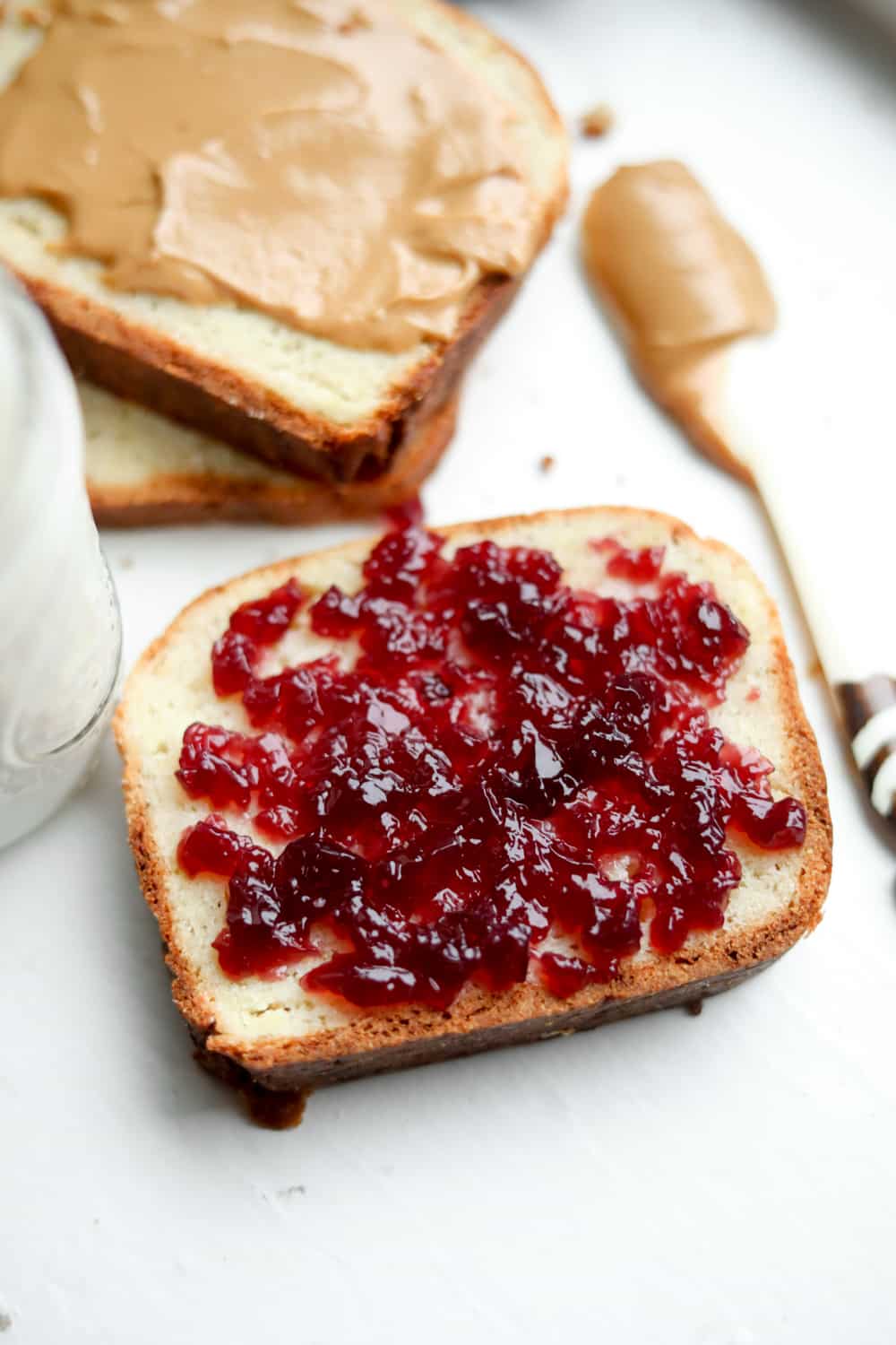 A slice of bread with jelly on it.