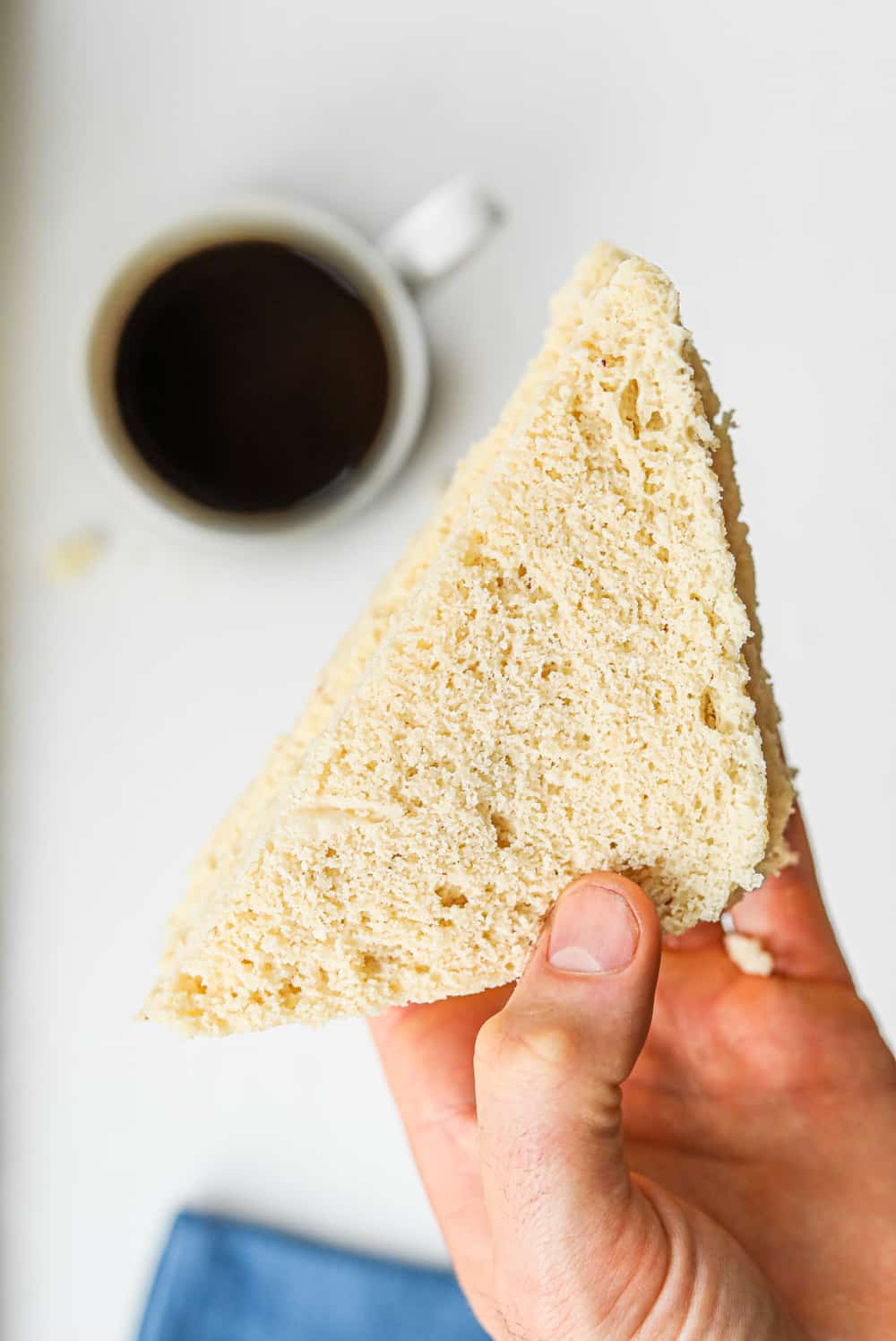 A hand holding keto bread