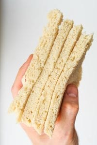 Slices of yeast bread held in a hand.