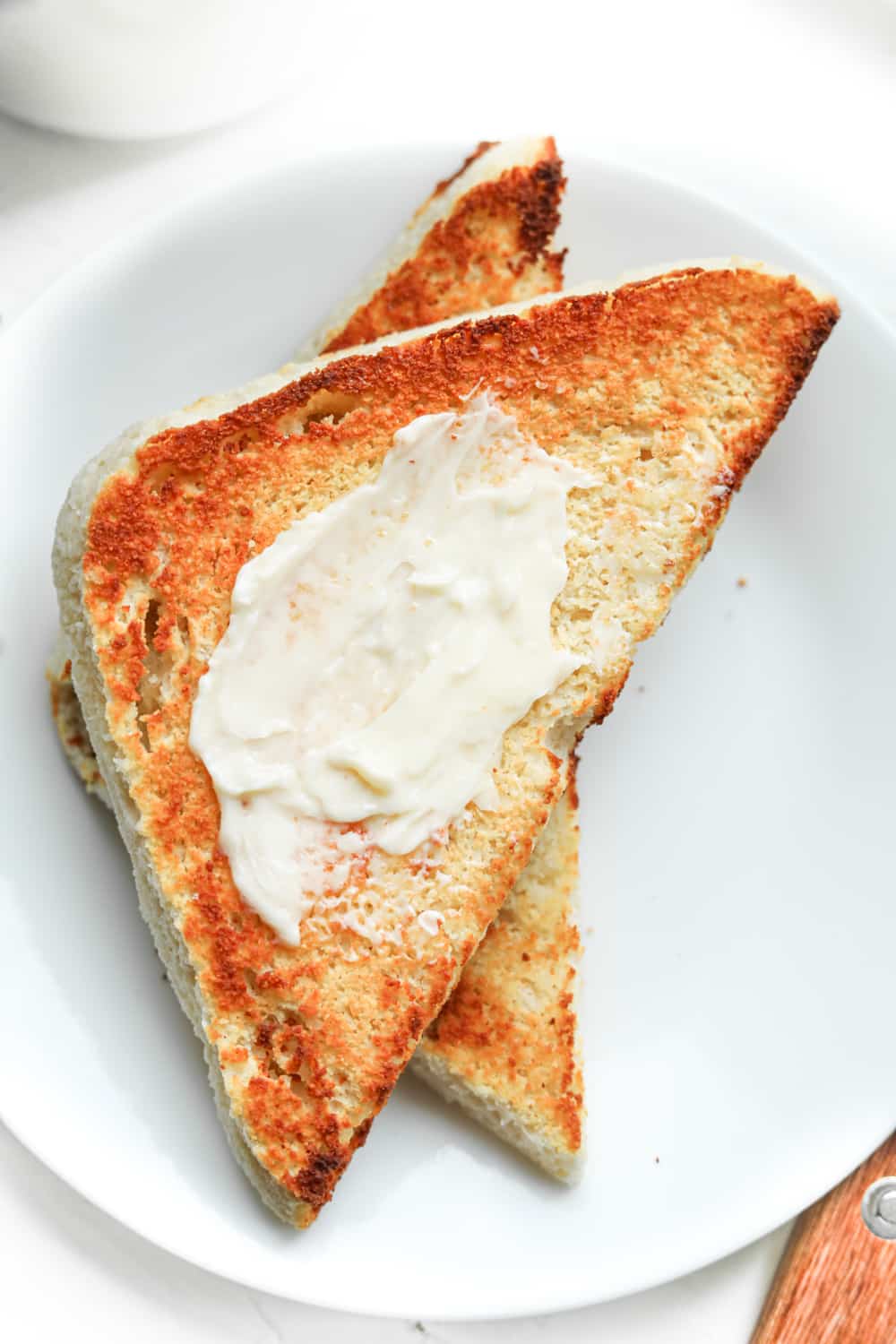 Low carb toast with butter spread on it.