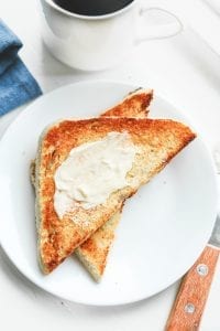 Keto toast on a plate with butter on it