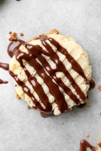 A butter cookie laying on a baking sheet.