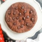 A keto double chocolate chip cookie on a plate.