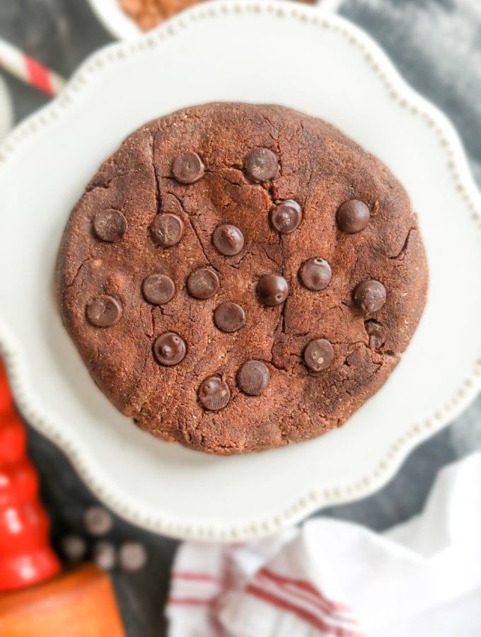 A keto double chocolate chip cookie on a plate.