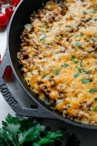 A keto cheeseburger casserole topped with chives.
