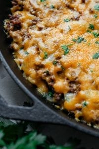 A low carb cheeseburger casserole in a cast iron pan