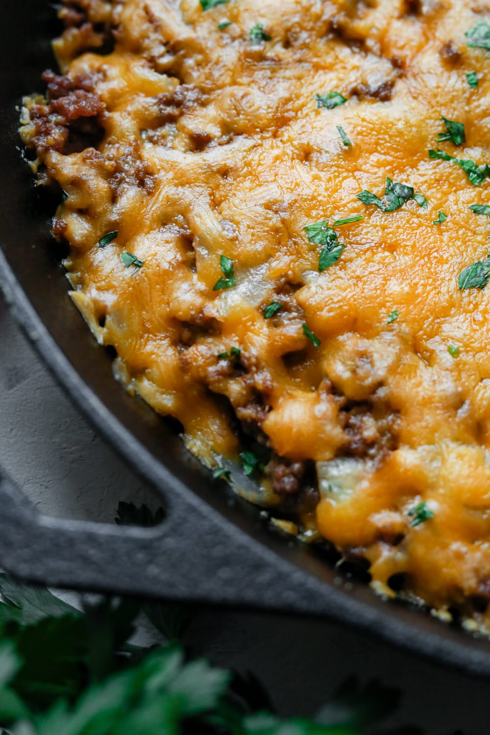 A low carb cheeseburger casserole in a cast iron pan 