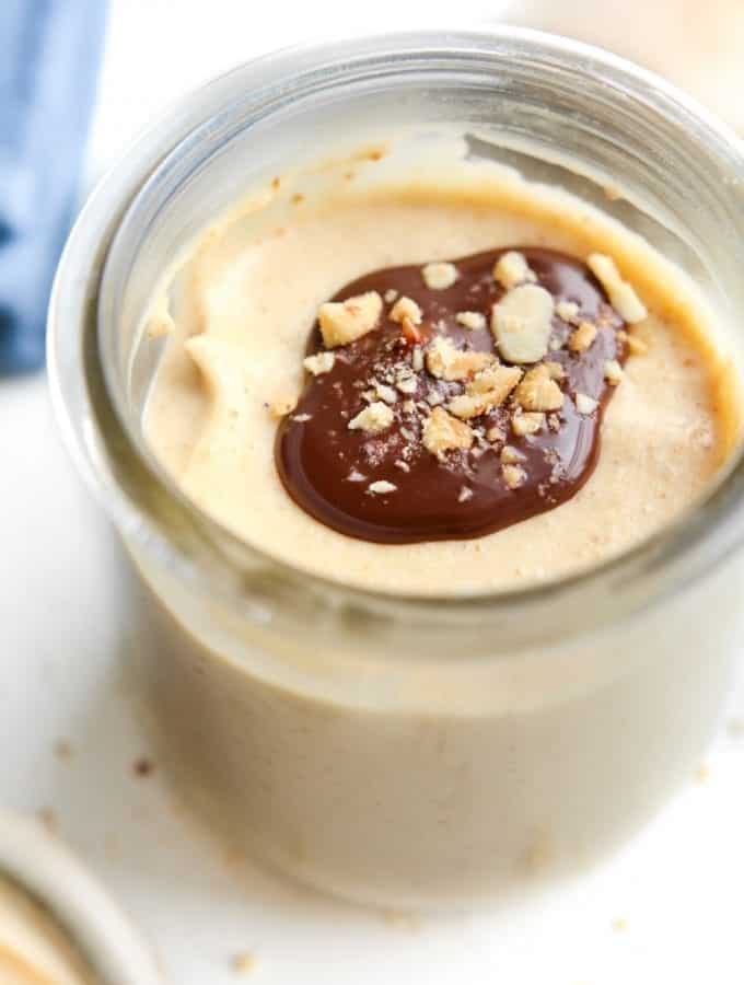 Peanut butter keto mousse topped with chocolate and peanuts.