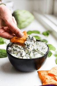 Low carb spinach and artichoke dip on a chip.