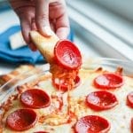 Low carb bread being dipped into keto bread.