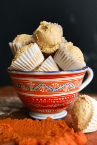 Pumpkin spice keto fat bombs in a cup.