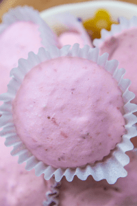 A strawberry fat bomb in a mini cupcake paper liner.