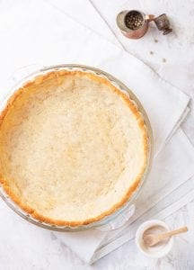 A savory keto pie crust in a pie plate.