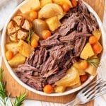 Keto pot roast on a serving platter next to a fork.