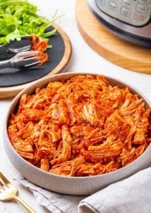 A bowl of freshly shredded BBQ chicken.