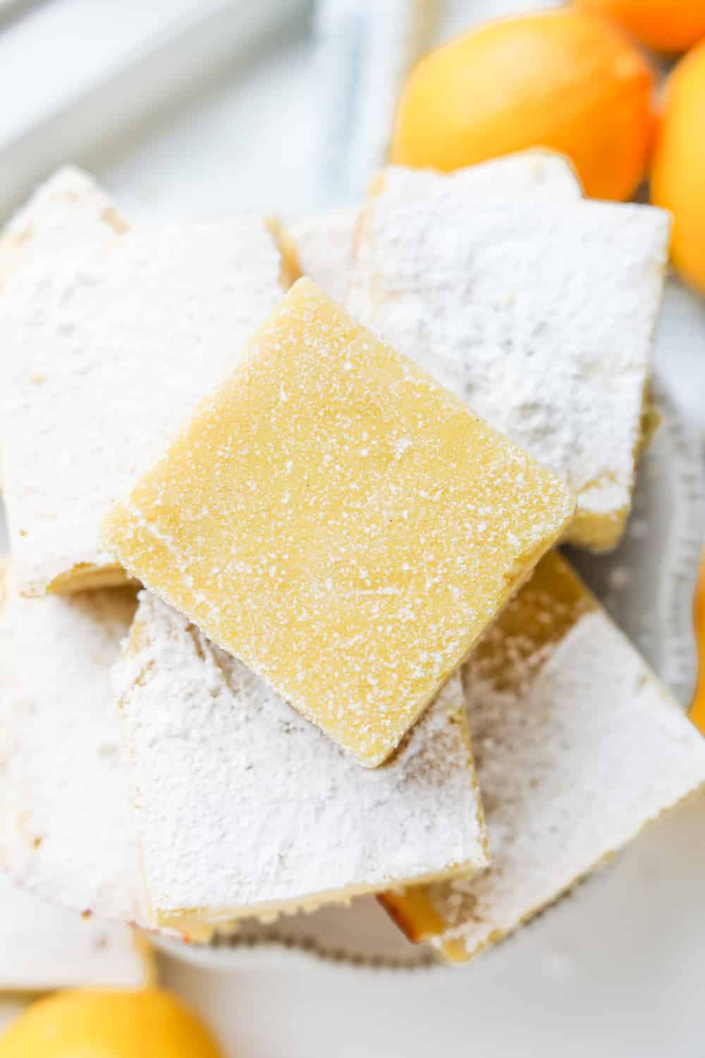 Lemon bars stacked on top of one another.