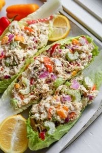 3 Chicken salad lettuce wraps on a tray.