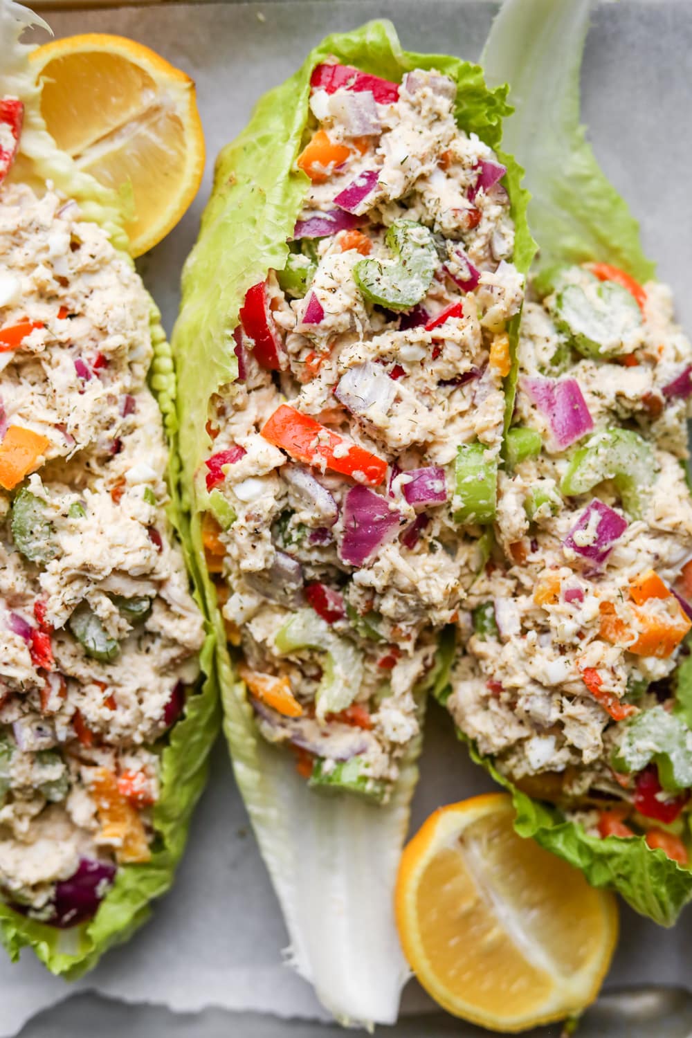 Chicken salad stuffed into 3 separate leafs of lettuce.