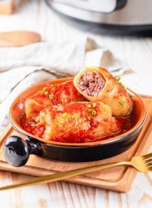 3 Keto cabbage rolls in a small dish.