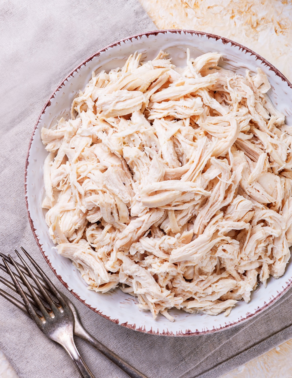 Shredded chicken in a bowl.