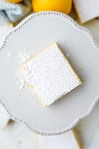 One keto lemon bar on a small serving dish.