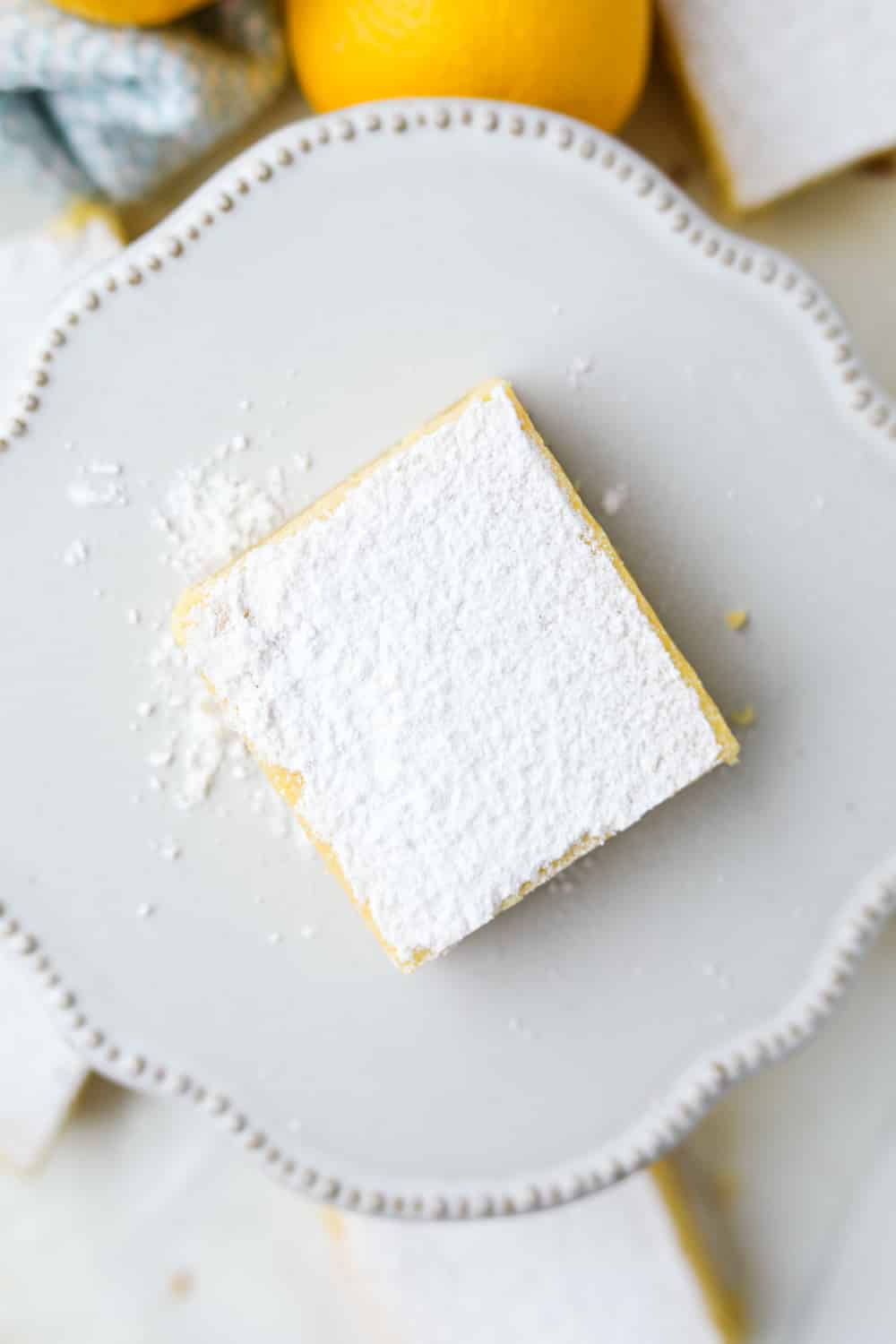 One keto lemon bar on a small serving dish.