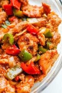 A large bowl filled with keto BBQ chicken and vegetables.