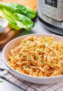 A bowl of shredded buffalo chicken.