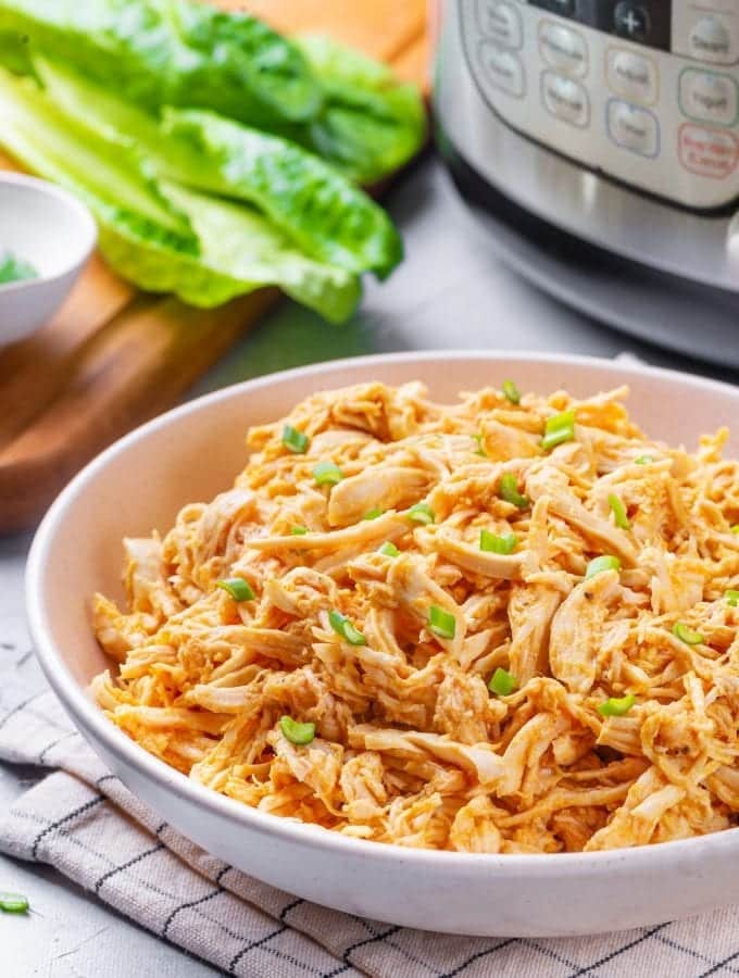 A bowl of shredded buffalo chicken.