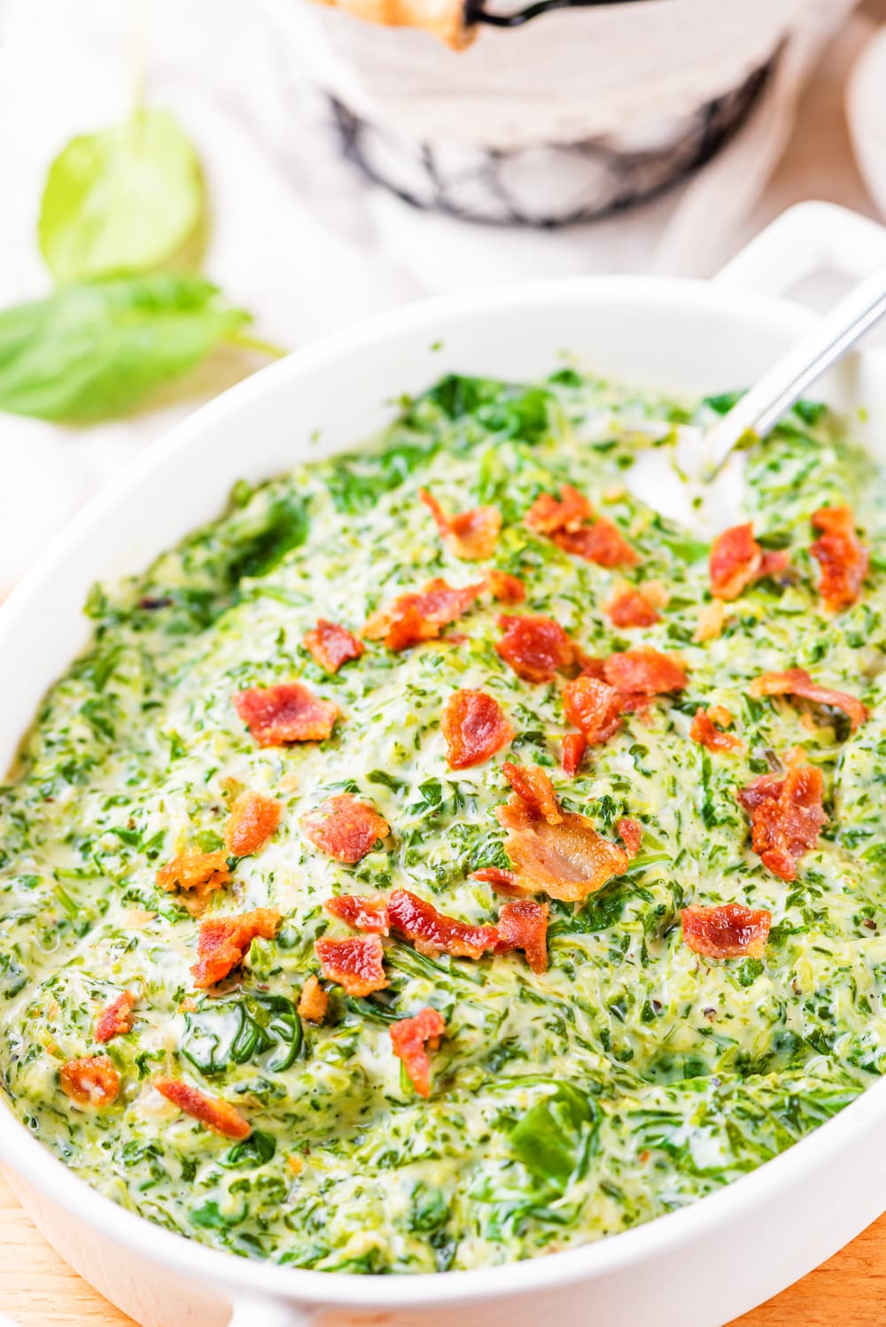Creamed spinach topped with bacon.