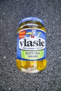Dill pickles in a jar.