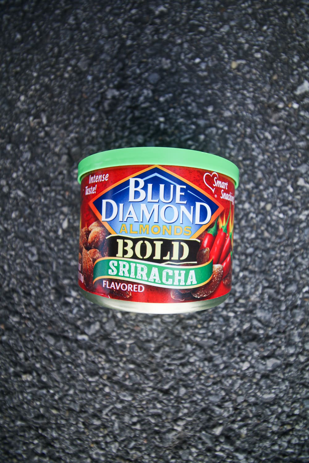 A container of sriracha almonds.