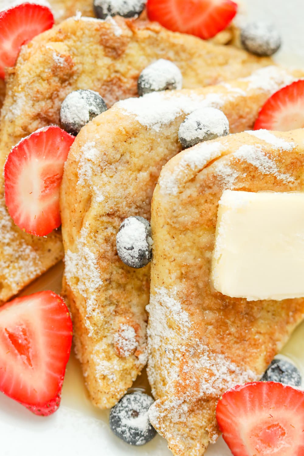 French Toast topped with berries and confectioners Swerve.