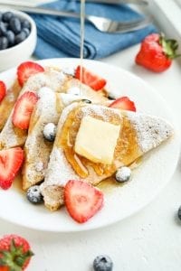 Keto maple syrup being poured on French toast.