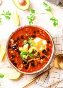 A bowl of soup on a table.