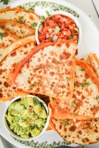 Cut up cheese quesadillas on a plate.