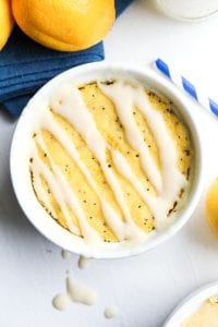 A lemon poppy seed mug cake covered in a sugar free glaze.