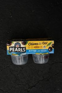 A package containing 4 Pearls Olive snack packs.