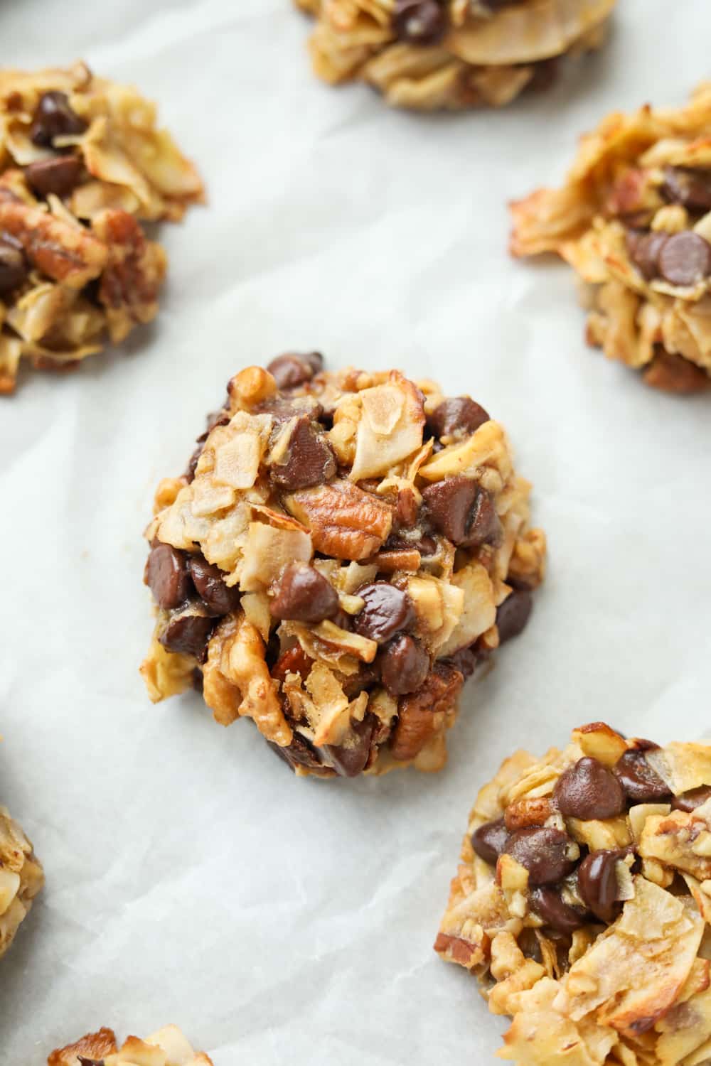 A cookie on white parchment paper.