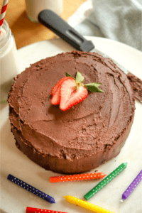 Chocolate cake on a white cutting board