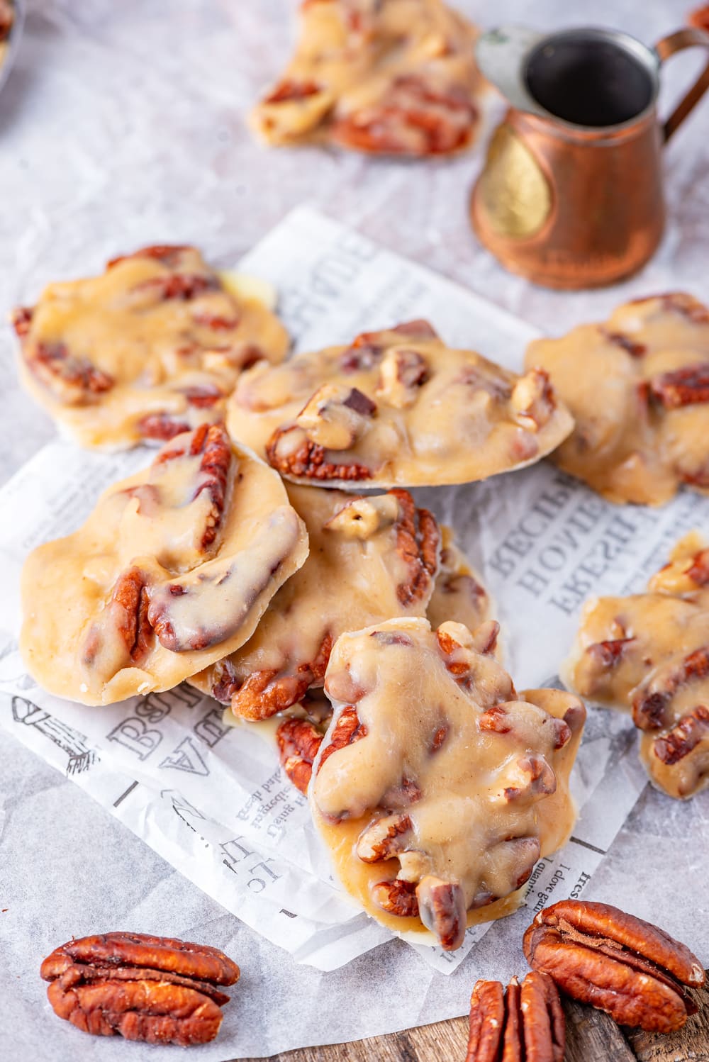 Pralines piled on top of each other on a sheet of paper.