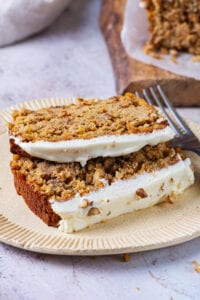 A couple of slices of carrot bread on a plate.